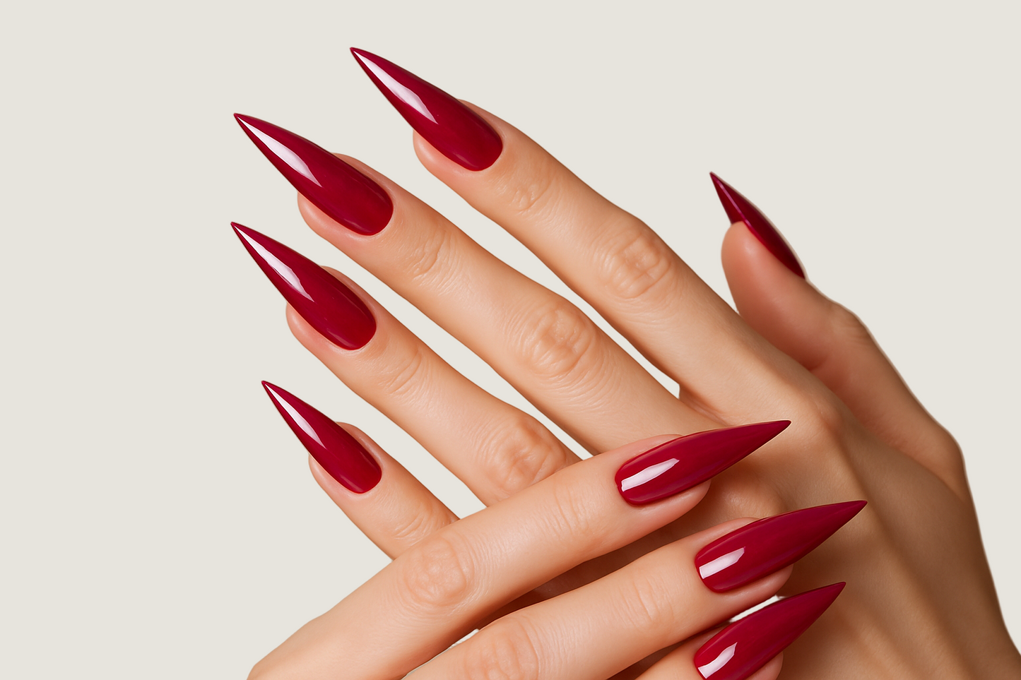 beautiful hands with this rasberry color on long stiletto nails